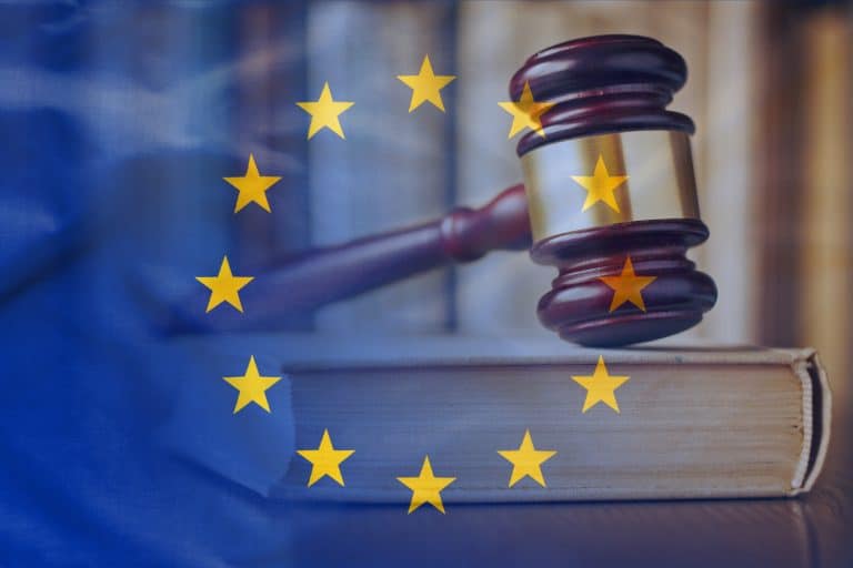 European Union flag with wooden gavel symbolising legal verdict