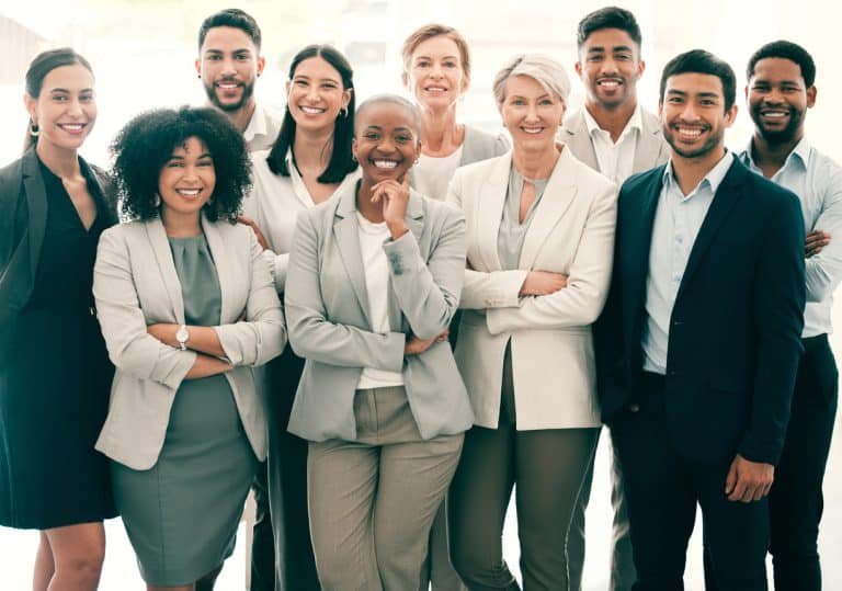 Group of businesspeople standing with arms crossed
