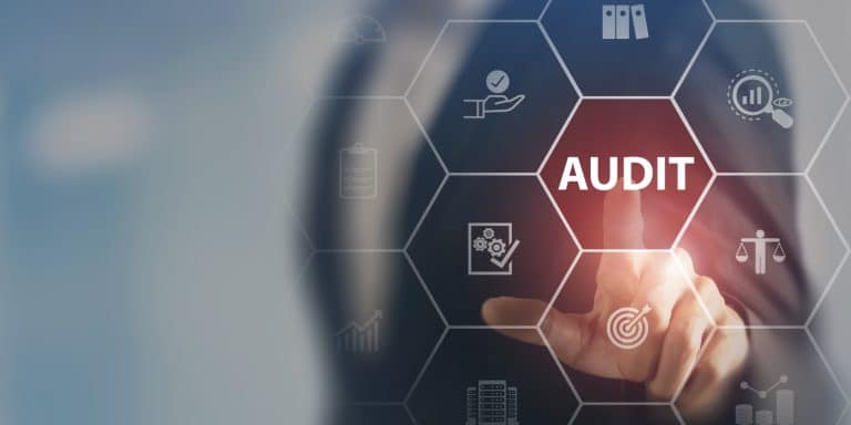 Businessman reviewing financial statements during an audit with smart background