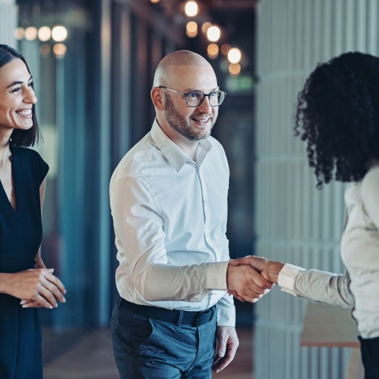 Businessman and businesswoman shaking hands