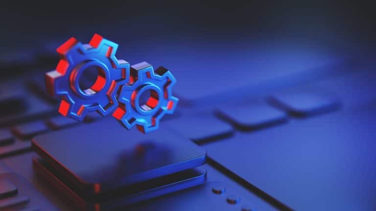 Two gears on an abstract technology background representing teamwork and collaboration